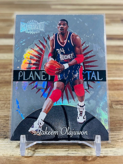 1997 Skybox Metal Universe #12 - Hakeem Olajuwon - Planet Metal